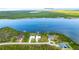 Aerial view of a neighborhood featuring waterfront homes along Interceptor Lagoon and Charlotte Harbor at 9464 St Marys Ct, Port Charlotte, FL 33981