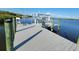 Exterior view of a dock with boat lift access on a sunny day at 9464 St Marys Ct, Port Charlotte, FL 33981