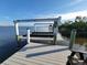 The boat lift on a private dock provides a convenient and secure space for watercraft storage at 9464 St Marys Ct, Port Charlotte, FL 33981