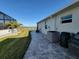 The home's exterior features a pool, lush lawn, waterfront views, and a convenient dock for boating enthusiasts at 9464 St Marys Ct, Port Charlotte, FL 33981