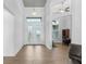 The foyer has a decorative glass front door and wood-look tile flooring at 9464 St Marys Ct, Port Charlotte, FL 33981