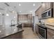 Spacious kitchen features stainless appliances, granite counters, tile backsplash, and ample cabinet space at 9464 St Marys Ct, Port Charlotte, FL 33981
