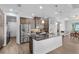 Modern kitchen featuring stainless steel appliances, granite countertops, and pendant lighting at 9464 St Marys Ct, Port Charlotte, FL 33981