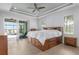 Bedroom features a large window and sliding glass door that allows you to enjoy lake and pool views at 9464 St Marys Ct, Port Charlotte, FL 33981