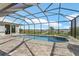 Screened in pool has a view of a lagoon and private boat dock at 9464 St Marys Ct, Port Charlotte, FL 33981