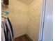 Walk-in closet features custom wire shelving and laminate wood flooring at 9464 St Marys Ct, Port Charlotte, FL 33981