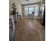 Bright kitchen featuring a large bay window, stainless steel refrigerator, and light colored cabinetry at 4553 Linwood St, Sarasota, FL 34232