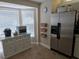 Well-lit kitchen featuring stainless steel appliances, a center island, and ample storage at 4553 Linwood St, Sarasota, FL 34232