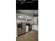Bright kitchen featuring stainless steel appliances, including a double oven and large refrigerator at 4553 Linwood St, Sarasota, FL 34232