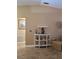 Living room featuring a small drink station against beige wall and decoratively placed liquor bottles at 4553 Linwood St, Sarasota, FL 34232