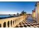 A spacious balcony offers stunning ocean views and checkered tile flooring at 1067 Westway Dr, Sarasota, FL 34236