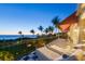 Relax on this home's balcony with ocean views and beautiful checkered tile at 1067 Westway Dr, Sarasota, FL 34236