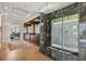 A luxurious bathroom features a marble shower, and a view to the gym at 1067 Westway Dr, Sarasota, FL 34236