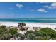 Stunning beachfront with white sand and clear turquoise water, perfect for relaxation at 1067 Westway Dr, Sarasota, FL 34236