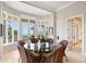 Bright breakfast nook with large windows, water views, and comfortable seating at 1067 Westway Dr, Sarasota, FL 34236