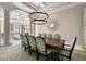 Elegant dining room featuring a large table, stylish chandelier, and modern decor at 1067 Westway Dr, Sarasota, FL 34236