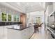 Gourmet kitchen with granite countertops, custom cabinets, and stainless steel appliances at 1067 Westway Dr, Sarasota, FL 34236
