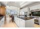 Bright, modern kitchen featuring a large island, stainless steel appliances, and water views at 1067 Westway Dr, Sarasota, FL 34236