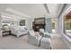 This spacious bedroom features a fireplace, sitting area, and stunning ocean views at 1067 Westway Dr, Sarasota, FL 34236