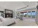 Luxurious main bedroom with fireplace, sitting area, and stunning ocean views from multiple windows at 1067 Westway Dr, Sarasota, FL 34236