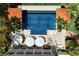 Aerial view of a luxury pool with elegant tilework, lounge chairs, umbrellas, and meticulous landscaping at 1067 Westway Dr, Sarasota, FL 34236