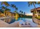 Luxurious pool area with lounge chairs, a gazebo, and beautifully landscaped surroundings at 1067 Westway Dr, Sarasota, FL 34236