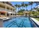Luxury home featuring a stunning pool with intricate tile design and outdoor lounging areas and gazebo at 1067 Westway Dr, Sarasota, FL 34236