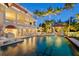 Luxurious outdoor space with a large pool, dining area, lounge chairs, and a picturesque gazebo for ultimate relaxation at 1067 Westway Dr, Sarasota, FL 34236