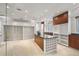 A luxurious walk-in closet features custom cabinets and an island at 1067 Westway Dr, Sarasota, FL 34236