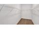 Spacious walk-in closet with white wire shelving and beautiful hard wood floors at 12719 Sunbridge Dr, Venice, FL 34293