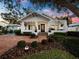 Charming home featuring manicured landscaping and a welcoming brick pathway leading to the front door at 1720 Bahia Vista St, Sarasota, FL 34239