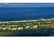 Aerial view of the condo near the Gulf with picturesque landscapes and bright blue skies at 2020 Harbourside Dr # 432, Longboat Key, FL 34228