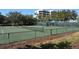 Well-maintained tennis courts surrounded by lush greenery, ideal for sports enthusiasts at 2020 Harbourside Dr # 432, Longboat Key, FL 34228