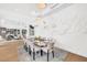 Elegant dining area featuring a unique wall art, stylish chairs and seating for ten at 2149 Hyde Park St, Sarasota, FL 34239