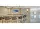 Entertaining space featuring a bar with TV and seating at 435 L Ambiance Dr # L807, Longboat Key, FL 34228