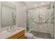 Bathroom with a modern marble shower, and a marble and wood vanity at 435 L Ambiance Dr # L807, Longboat Key, FL 34228