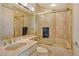 Bathroom with a combination tub and shower, stylish hardware, and marble-style tile at 435 L Ambiance Dr # L807, Longboat Key, FL 34228