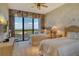 Bedroom with twin beds, balcony access, and beautiful ocean views at 435 L Ambiance Dr # L807, Longboat Key, FL 34228