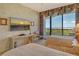 Bedroom with twin beds, balcony access, and beautiful ocean views at 435 L Ambiance Dr # L807, Longboat Key, FL 34228