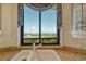 Close-up of kitchen sink with golf course view at 435 L Ambiance Dr # L807, Longboat Key, FL 34228