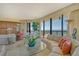 Bright living area with ocean view and access to balcony at 435 L Ambiance Dr # L807, Longboat Key, FL 34228