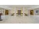 Bright lobby features marble floors, elegant seating, and a decorative accent wall at 435 L Ambiance Dr # L807, Longboat Key, FL 34228