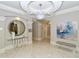 Condo lobby with decorative mirror, modern bench, and artwork at 435 L Ambiance Dr # L807, Longboat Key, FL 34228