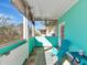 Cozy screened balcony with charming decor, comfortable seating, and a serene outdoor retreat at 4802 51St W St # 1811, Bradenton, FL 34210