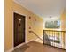 Welcoming condo entryway featuring a secure front door and stair access, offering a glimpse of the tranquil surroundings at 4802 51St W St # 1811, Bradenton, FL 34210