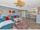 Cozy living room with stylish decor, comfortable seating, ceiling fan, and a built-in mirrored office nook at 4802 51St W St # 1811, Bradenton, FL 34210
