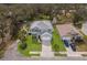 Aerial shot of a two-story home with a well-manicured lawn and mature landscaping, showcasing its desirable curb appeal at 5809 71St E St, Palmetto, FL 34221