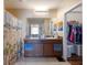 This bathroom has a dual sink vanity, large mirror, shower with a beach-themed curtain, and a walk-in closet at 5809 71St E St, Palmetto, FL 34221