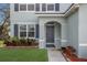 Charming front entrance featuring a stylish door, neat landscaping, and a well-maintained walkway at 5809 71St E St, Palmetto, FL 34221