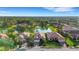 Scenic aerial view of homes surrounding a serene lake in a lush, landscaped community at 8079 36Th Street E Cir, Sarasota, FL 34243
